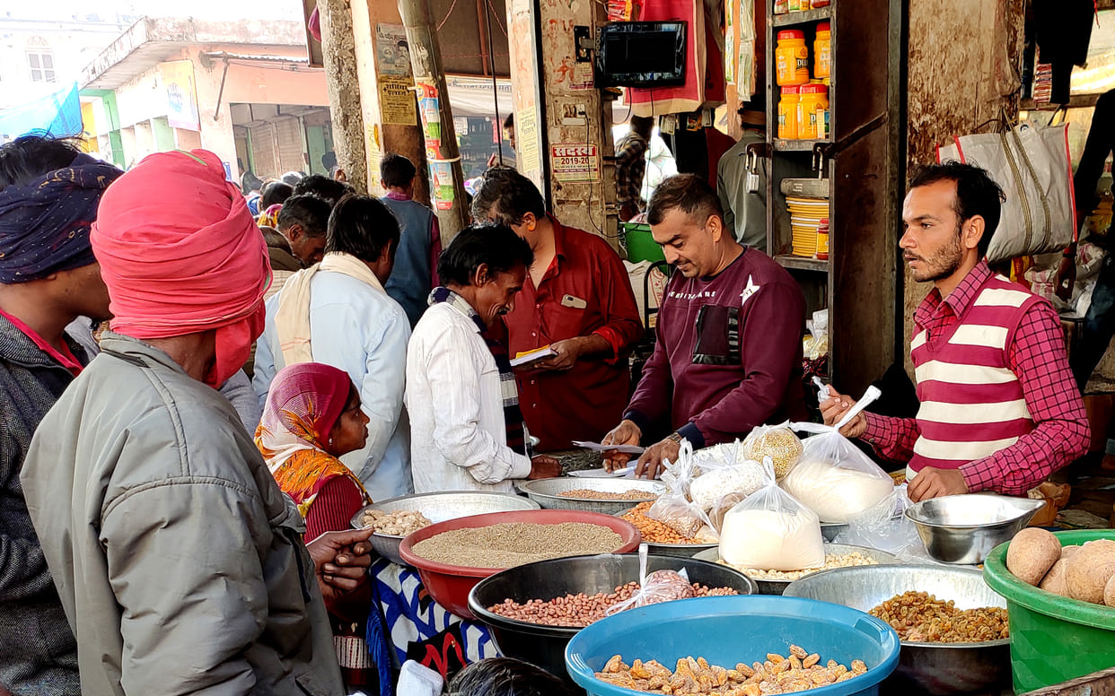 Sweat Gud and Mewa wait in polythean  from Makarsankranti festiwal