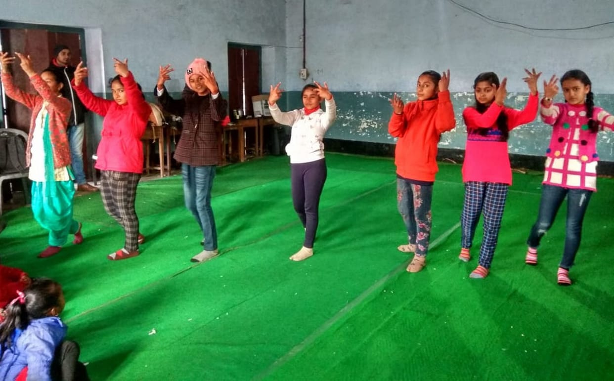Children are learning  yoga and dance