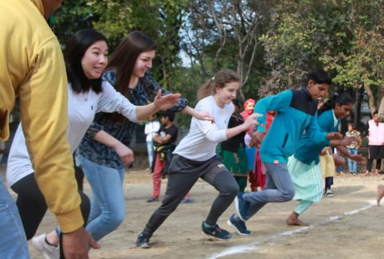 American girl students play many games with women and girls of Haryana's village