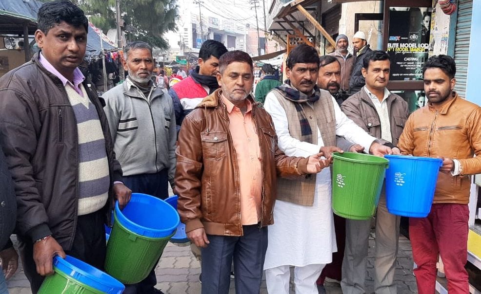 chairman distirbute dustbin for will clean town