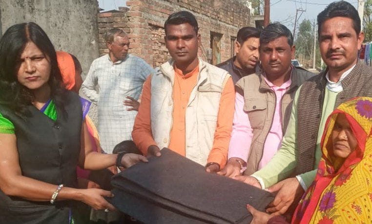 Distribute blankets to the needy