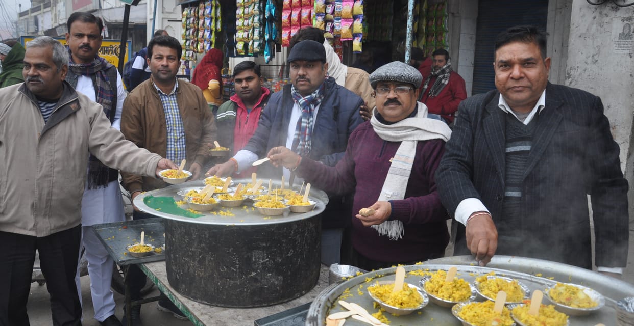 Polenta distributed on Makar Sankranti, warm clothes