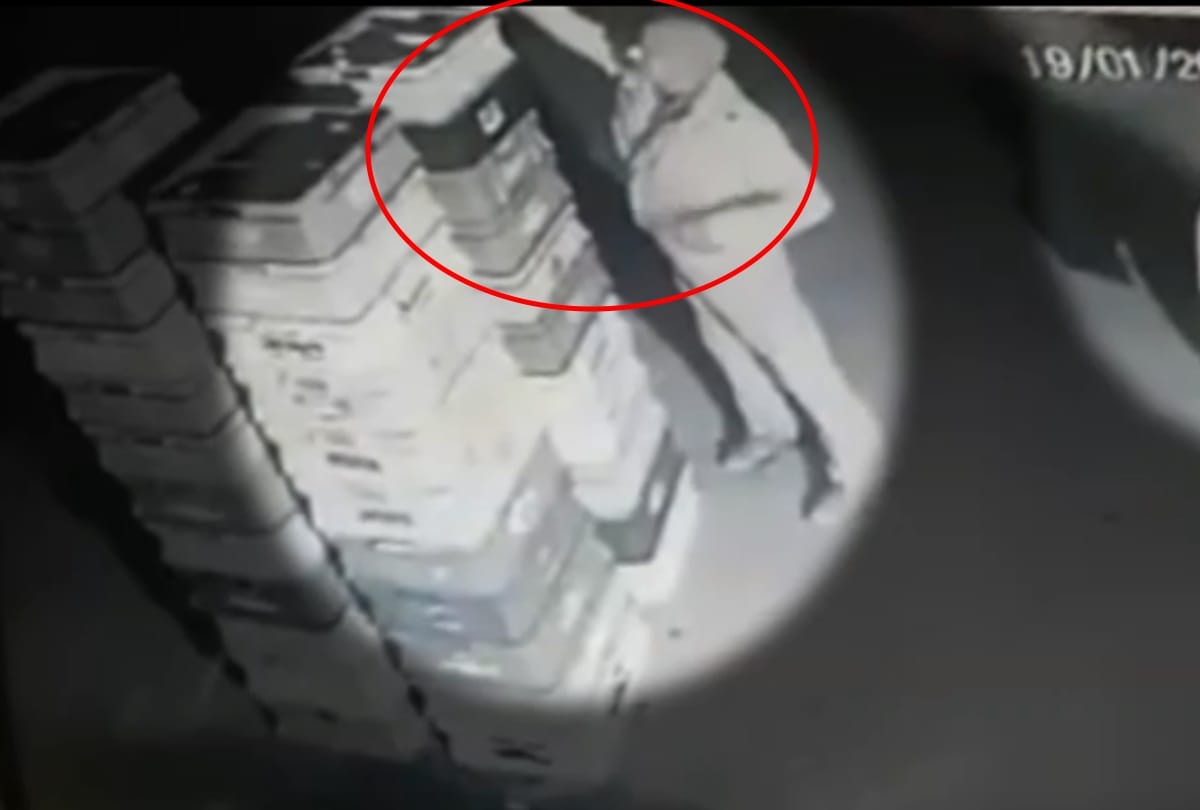 noida policeman caught in cctv camera picking milk packet secretly social media alleges theft