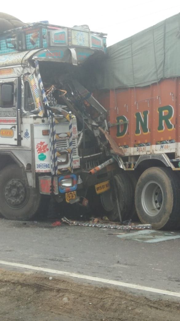 Bus overturned after two trucks collided, truck driver killed