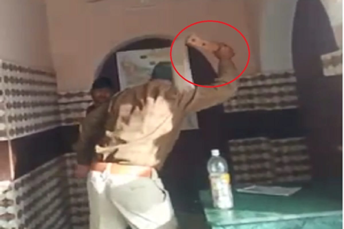 Inspector beaten up a youth in police station at Bijnor district of Uttar Pradesh