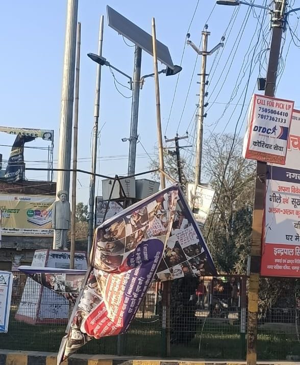 Flax torn with photo of miscreants