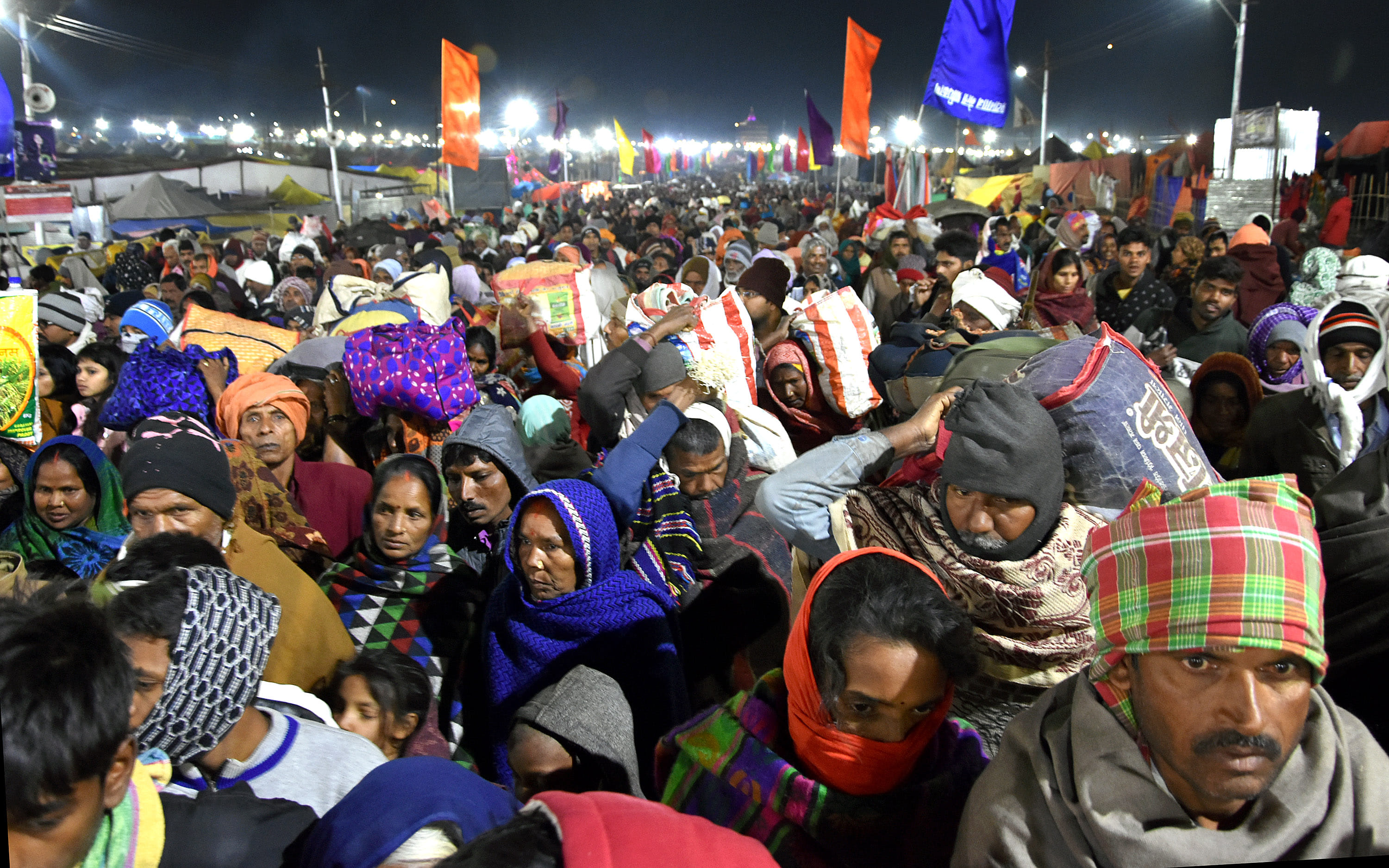 The Mahakumbh of the believers for a dip at the confluence, the wreath of the helicopter