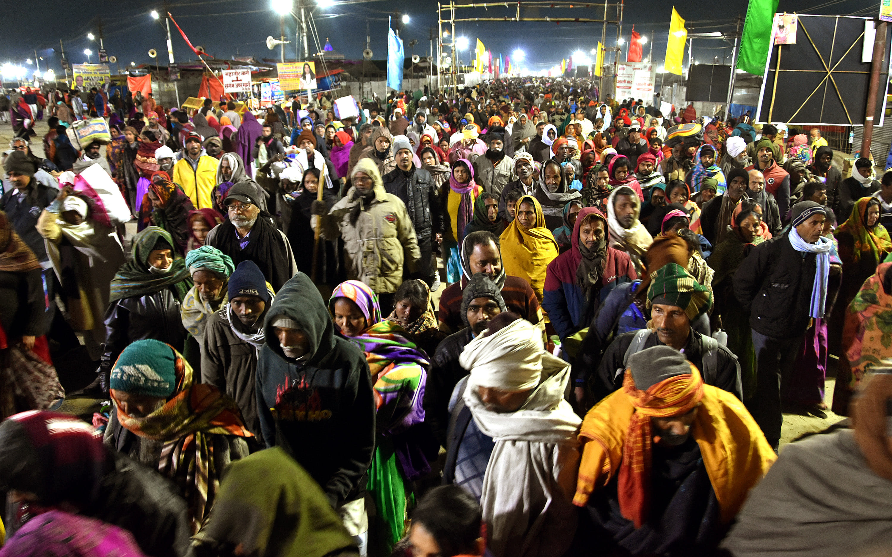 The Mahakumbh of the believers for a dip at the confluence, the wreath of the helicopter