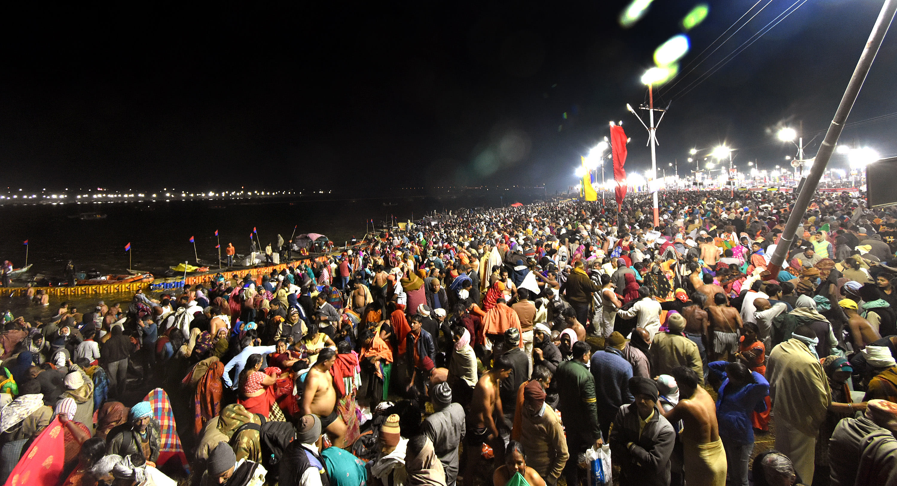 The Mahakumbh of the believers for a dip at the confluence, the wreath of the helicopter