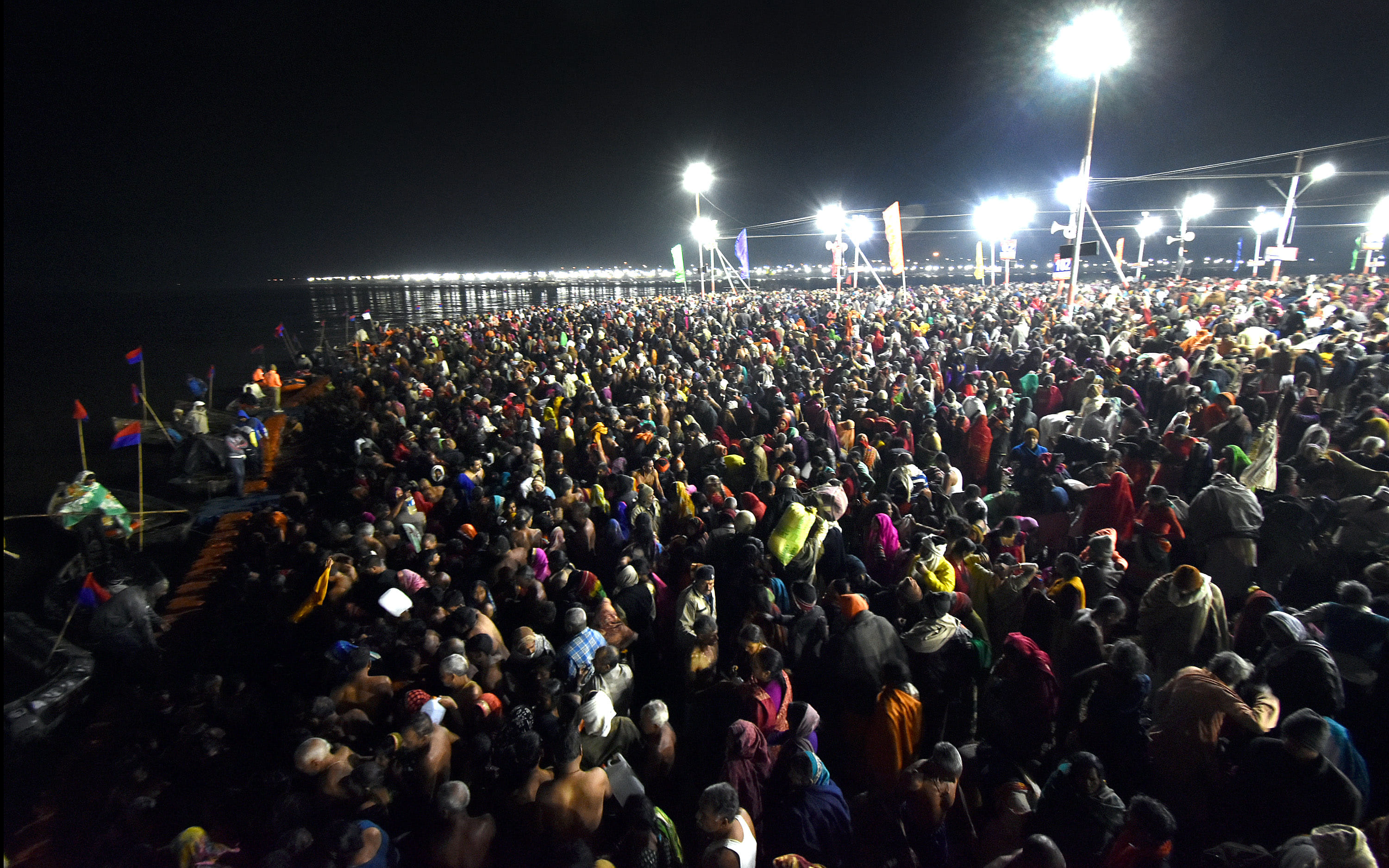 The Mahakumbh of the believers for a dip at the confluence, the wreath of the helicopter