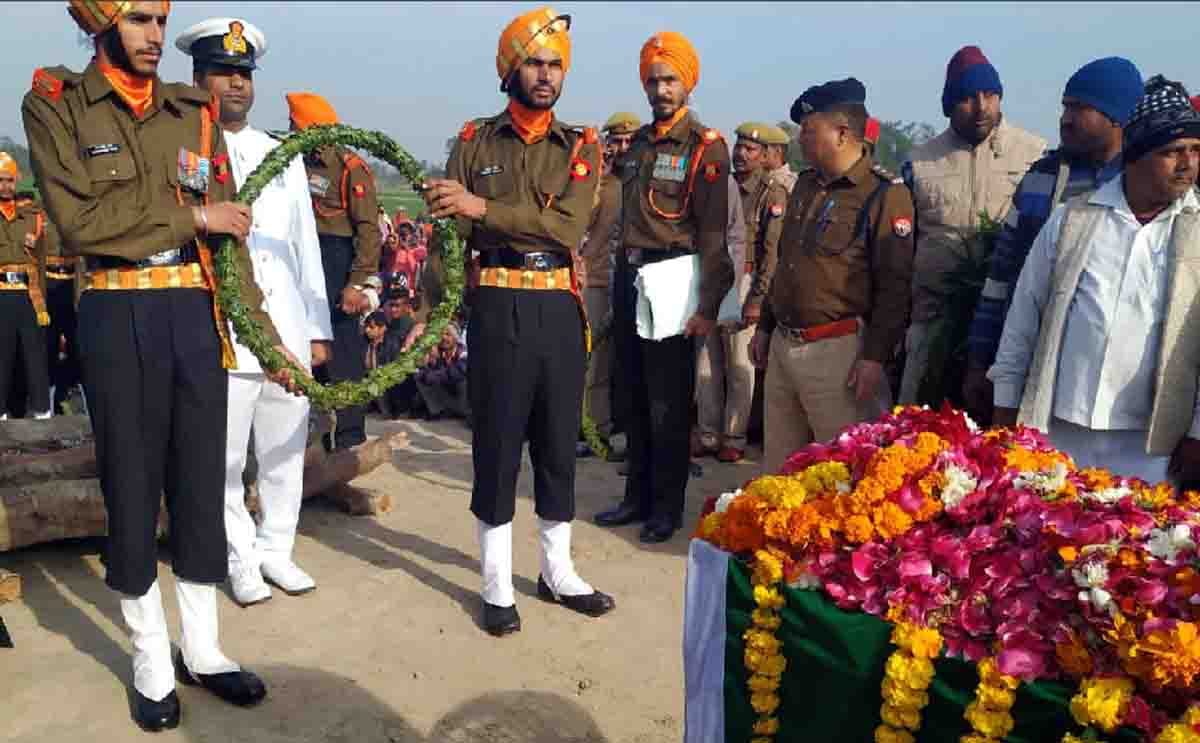 Soldier handed the tricolor with the mortal remains of the martyr