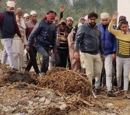 Villagers raging on pouring dirt from the road