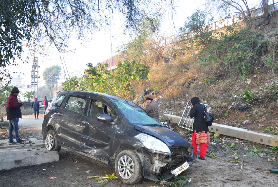 Car collapsed in railway colony after breaking railing of court bridge