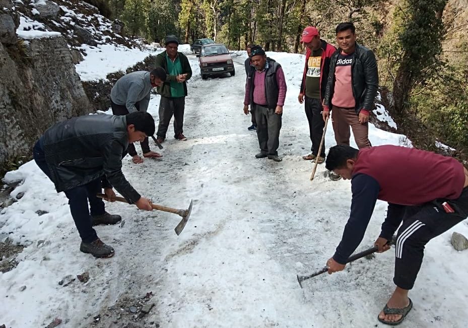 Villagers drinking water after melting snow