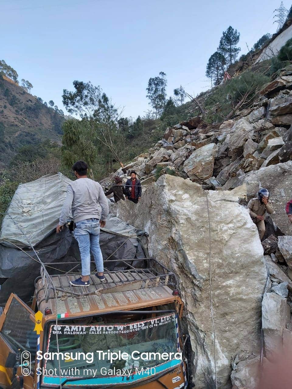 Mountain Collapse on badrinath highway, Public cross road with very Difficulty photos