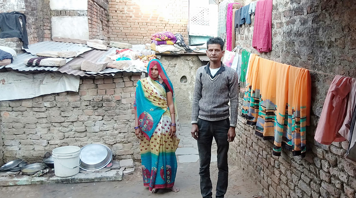 Family living in the open in the hope of housing