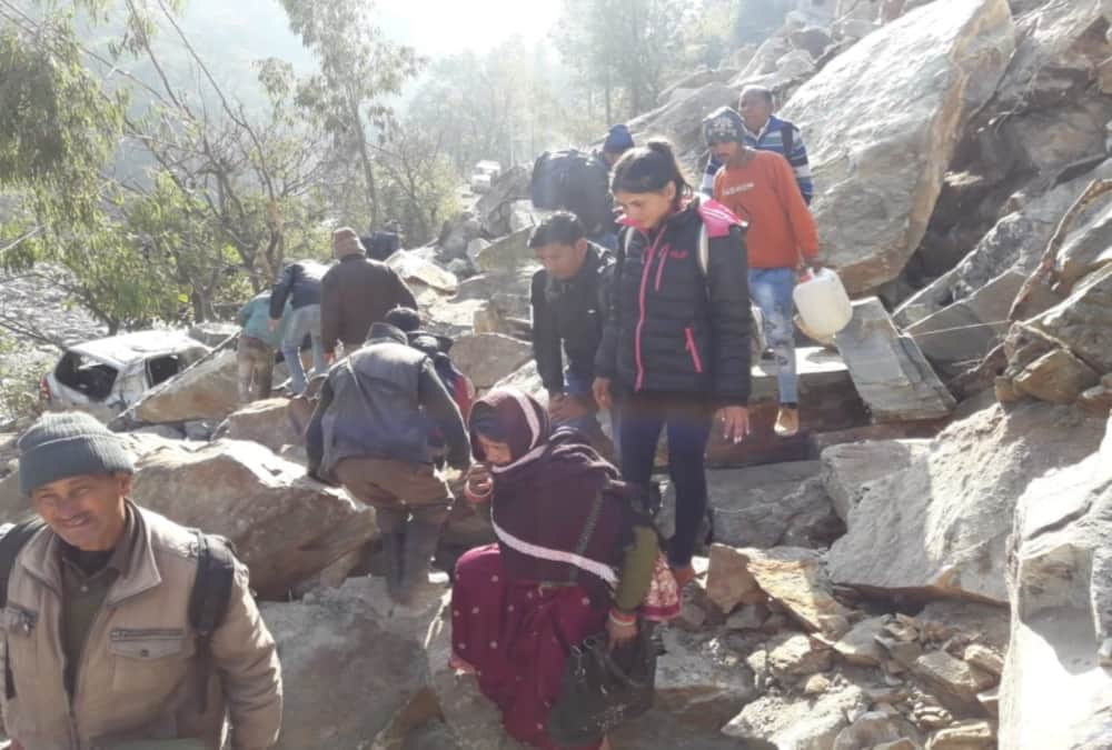 Mountain Collapse on badrinath highway, Public cross road with very Difficulty photos