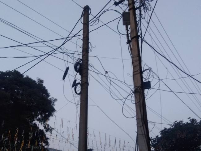 businessman complaining electric wires in power corporation office gorakhpur