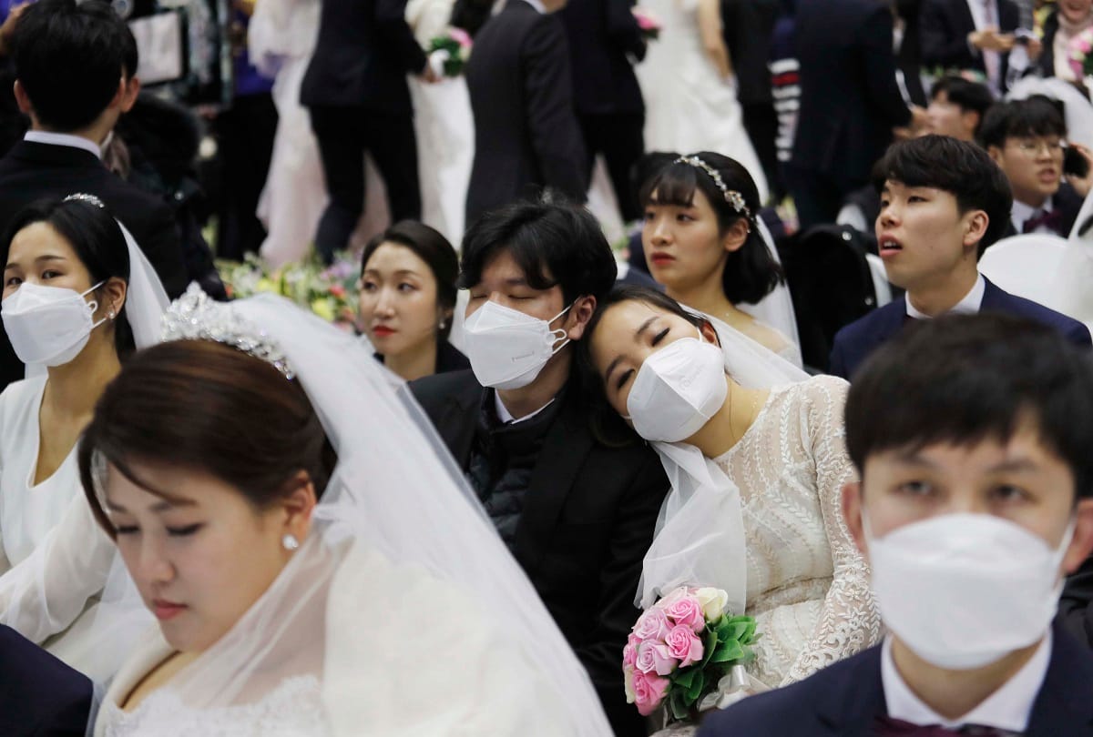 South Korea mass wedding defies coronavirus fears, some wears mask