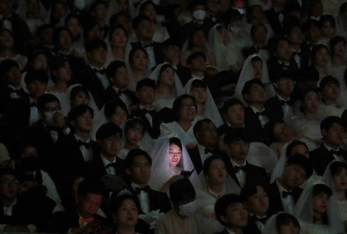 South Korea mass wedding defies coronavirus fears, some wears mask