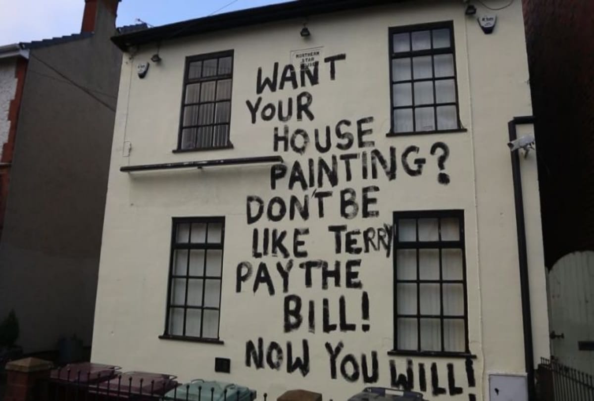 england viral painter writes angry message on building after not getting wages