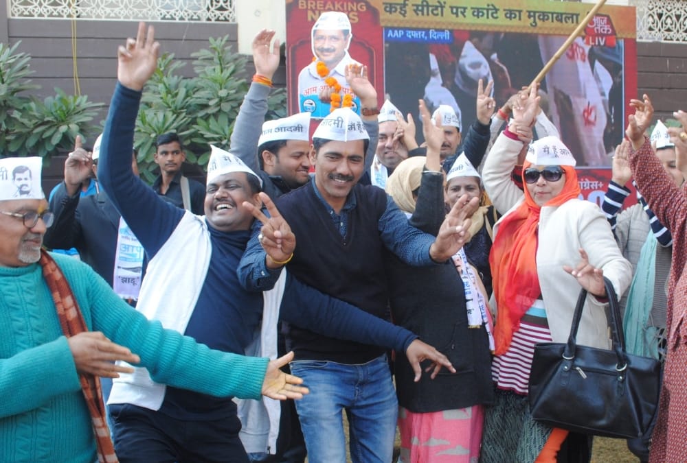Aam Admi Party workers celebrate victory in Uttar Pradesh.
