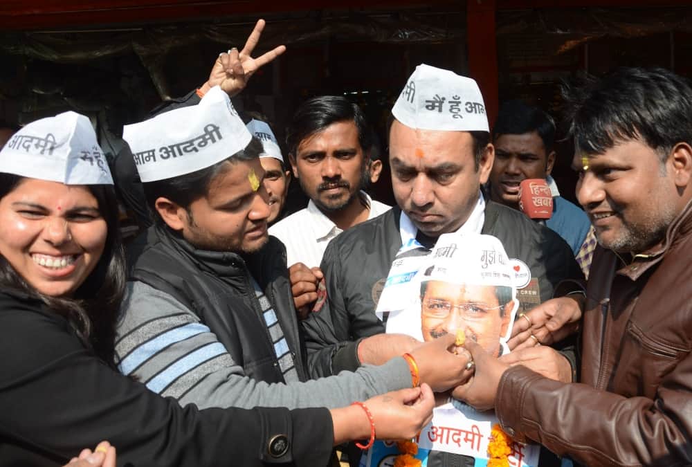 Aam Admi Party workers celebrate victory in Uttar Pradesh.