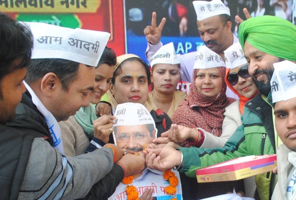 Aam Admi Party workers celebrate victory in Uttar Pradesh.