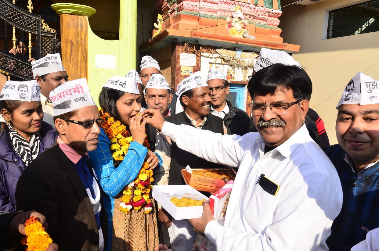 Workers distributed sweets on AAP's victory in Delhi