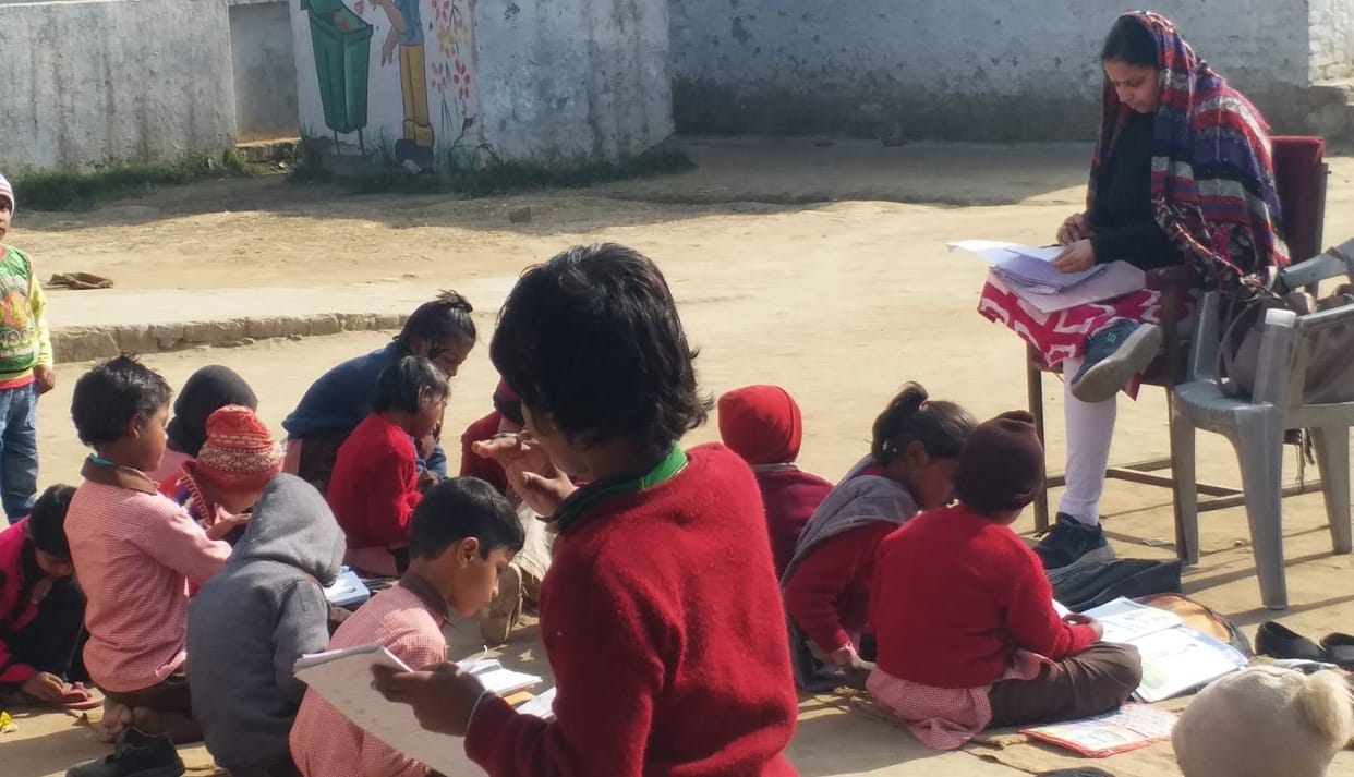 Children studying sitting on shattered bandage