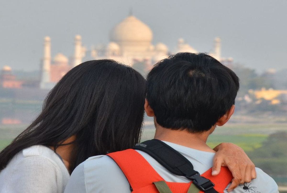 tourists seen the Taj Mahal from Mehtab Bagh on Valentine's Day