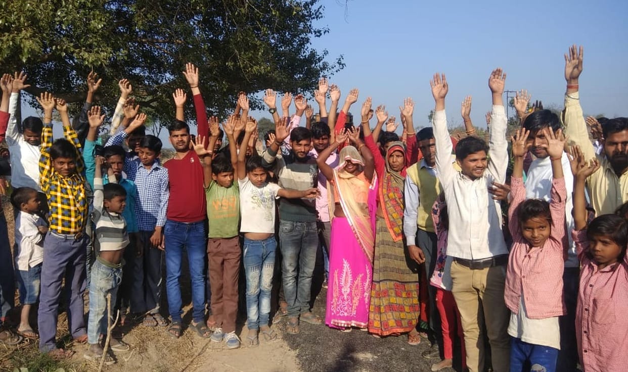 villagers protest aginst bumpy road