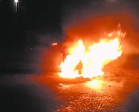 A burnt car on the Nainital highway