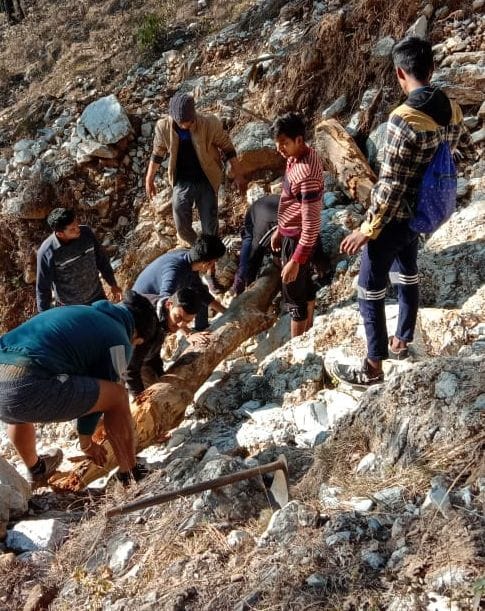 Youth engaged in road repair