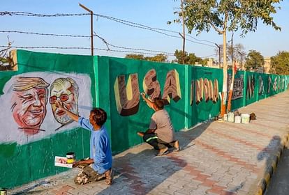 झूग्गियों को ढंकने के लिए अहमदाबाद नगर निगम ने दीवार बनाई है
