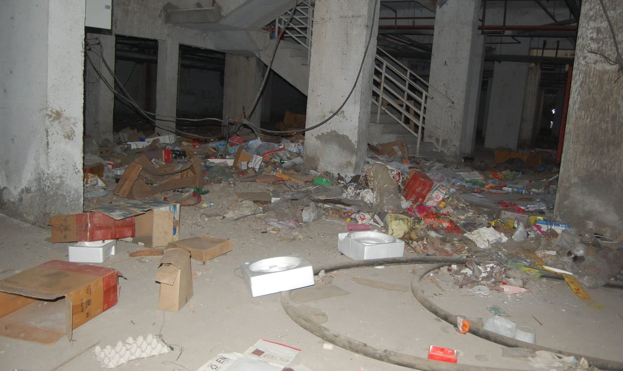 sewer water seeping from walls in tdi espania flats, danger of building collapse, women protest, commotion