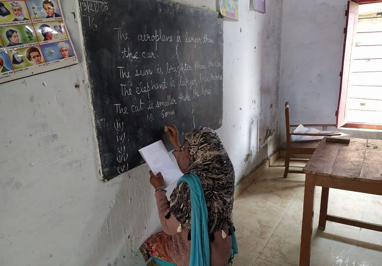 teachers wriiten answers on black board