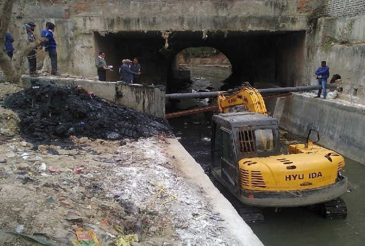 Municipal corporation workers put in cleaning near Taj Mahal