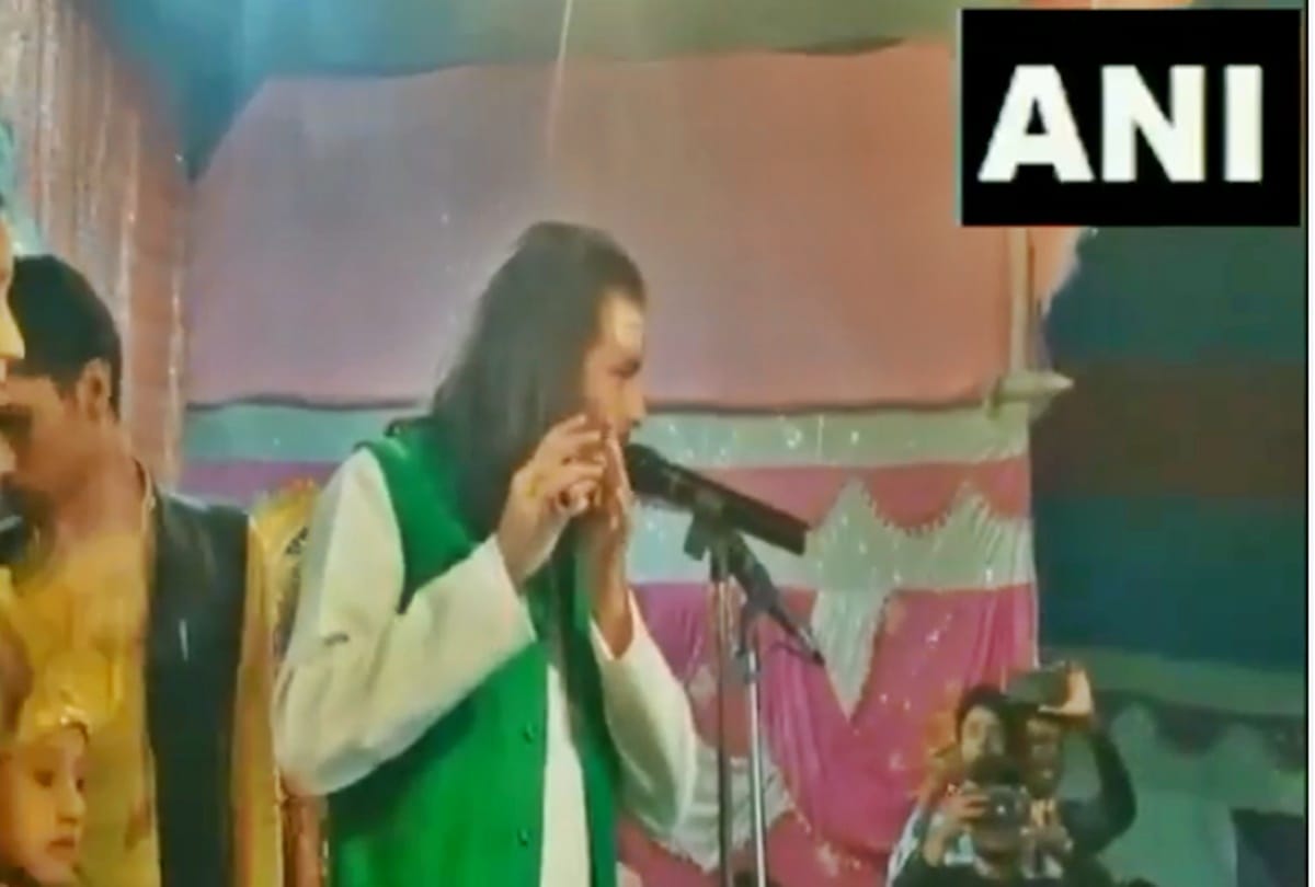 RJD leader Tej Pratap Yadav plays the flute during Maha Shivratri celebrations in Vaishali, Bihar