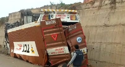 Truck falls from flyover stuck in pits, driver's condition critical