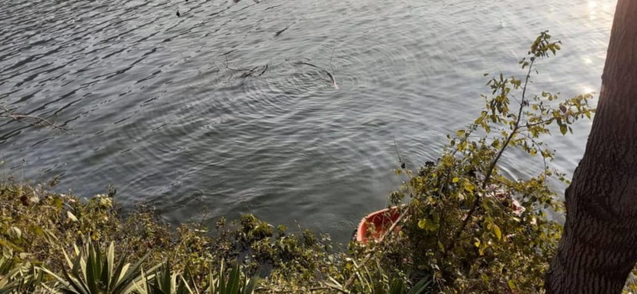 A woman jumped into lake after throwing her son in Shravasti.