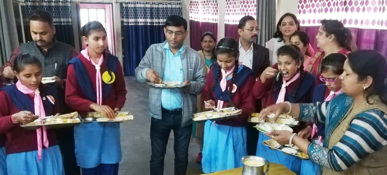 adm f eating food with girl student  in the time of kasturba school inspection