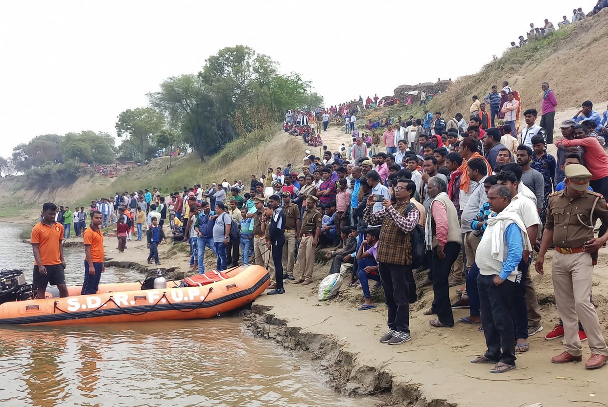 Teenager's body found, searching for four