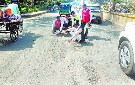 Road pits in front of PWD office in danger