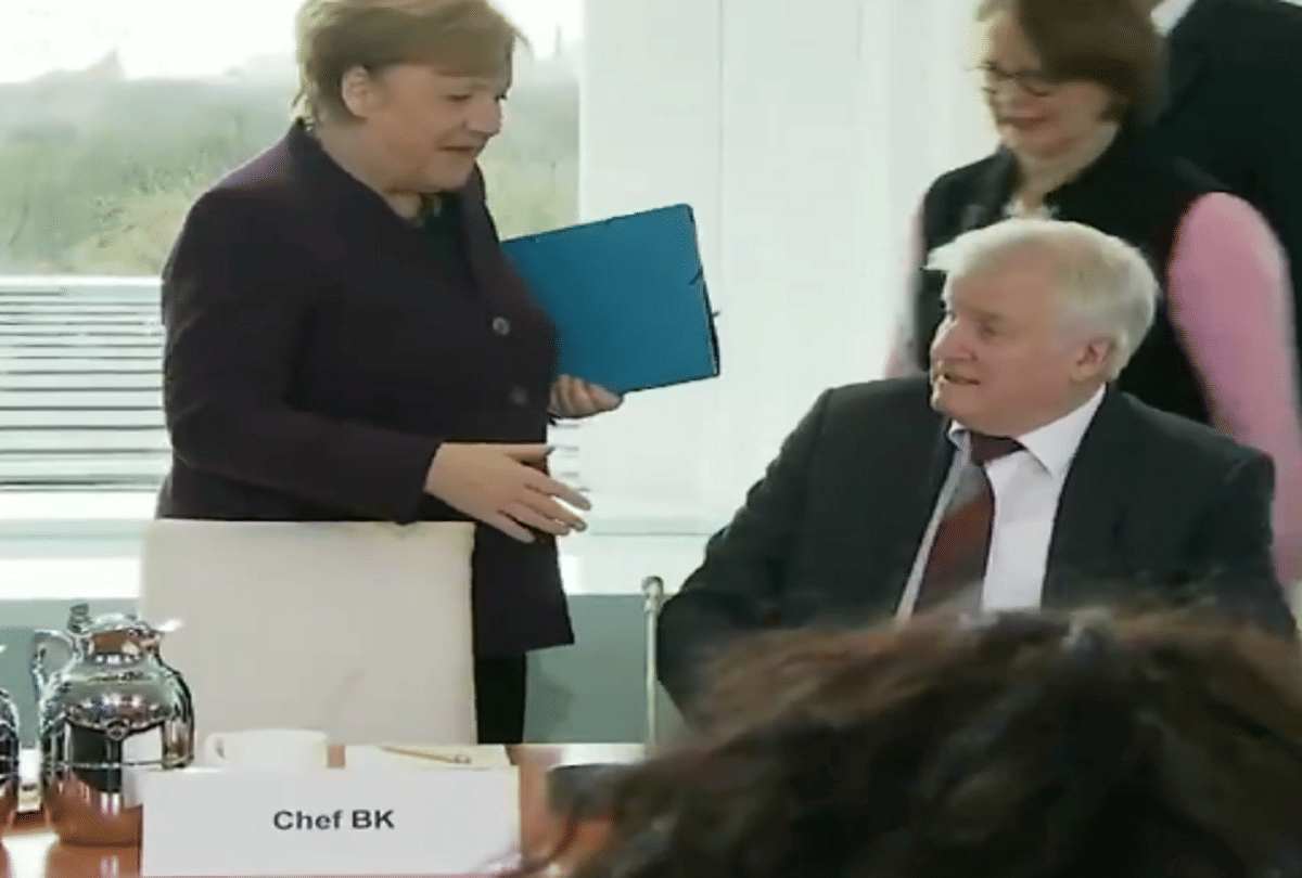 coronavirus effect german home minister rejects proposal to hand shake of chancellor video viral