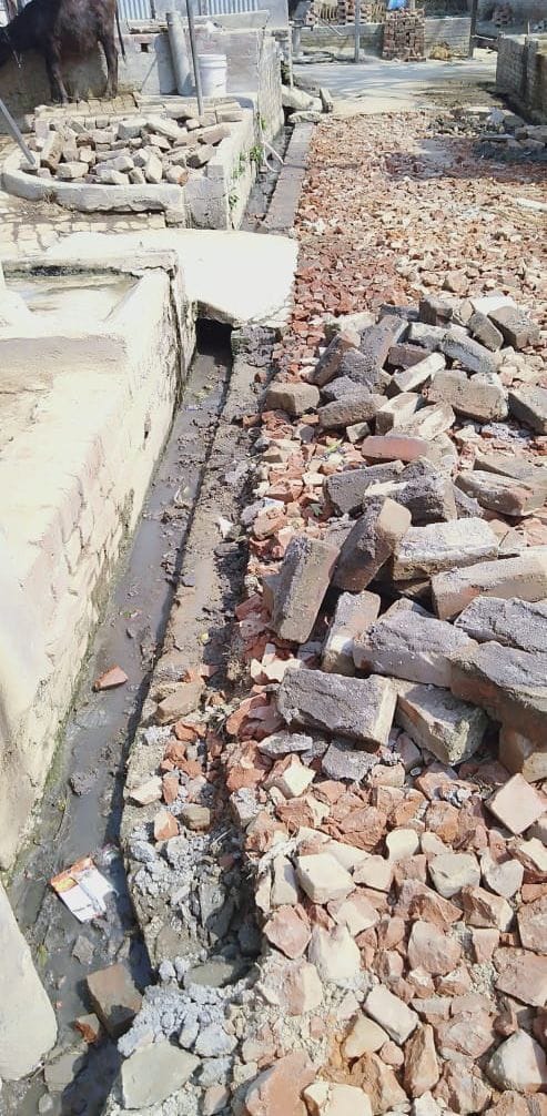 Old bricks are engaged in drain construction