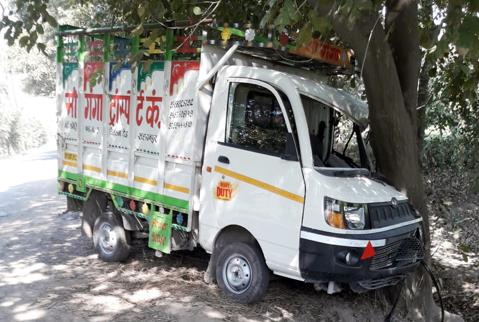 Pickup collides with tree in escape