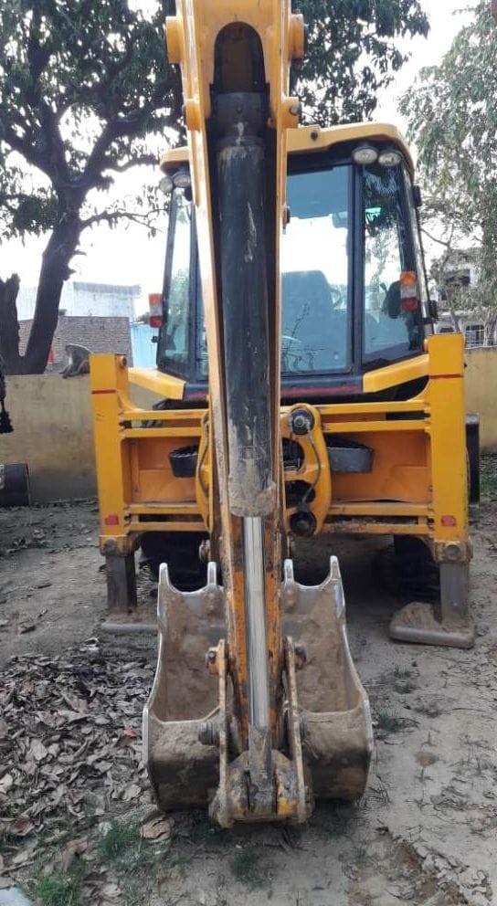 one person arest, with jcb in soil digging