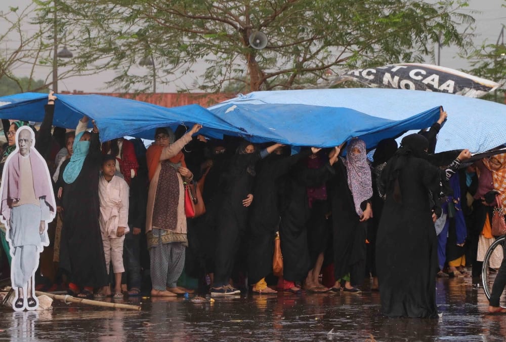 Women protest continue even during rain on Ghantaghar   in Lucknow.