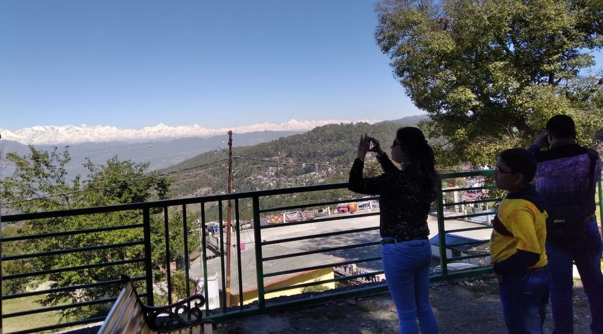 Tourists captured the view of the Himalayas on camera
